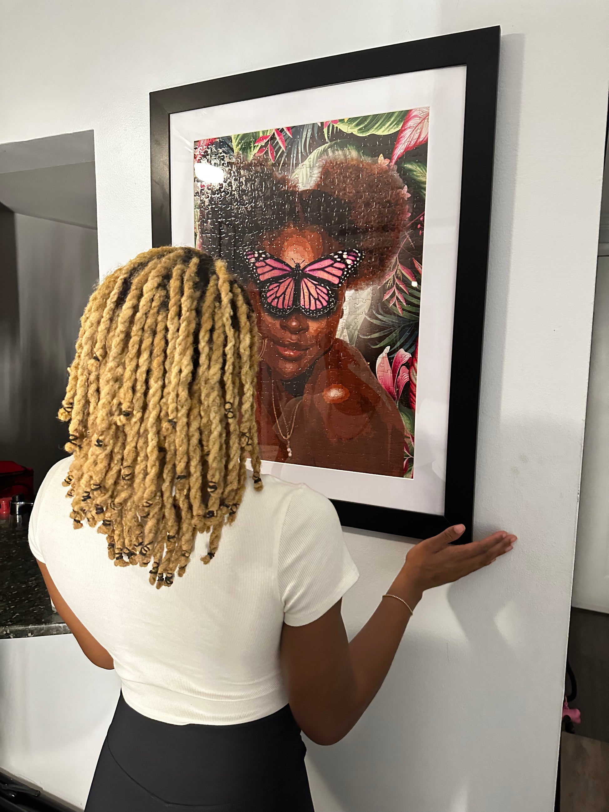 Finished Pink Puff Black art jigsaw puzzle framed and hung on a wall